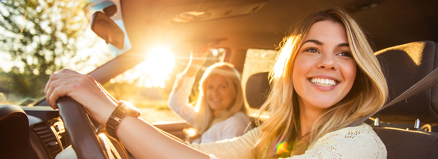 Lady smiling in a car