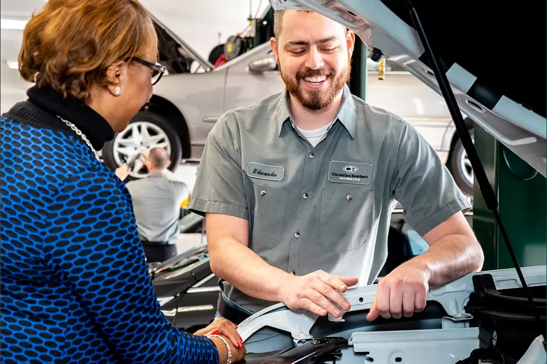 Christian Brothers employee working on client's vehicle